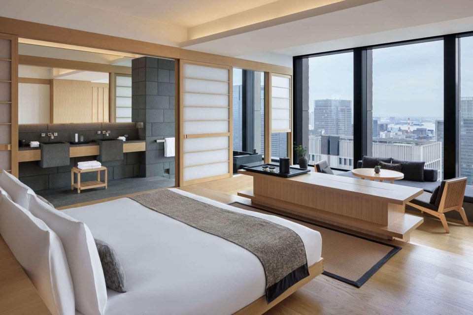 A lobby opening through several storeys near the head of a Tokyo office tower.